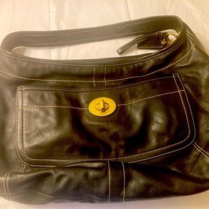 Coach brand Black leather purse.